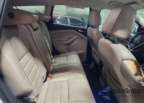 2017 Ford Escape Titanium z USA, uszkodzony, nr VIN 1FMCU0J9XHUE18306